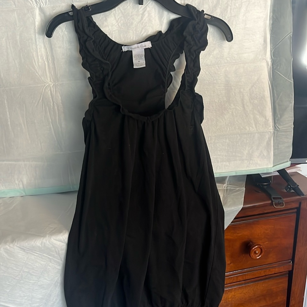 Charlotte Russe size Medium 
Black tank top with ruffle sleeves